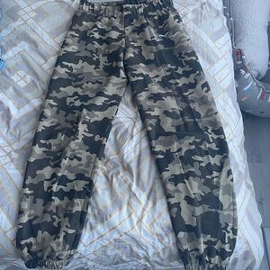 Size medium. Brand is LazyPants. Great soft material. Camouflage